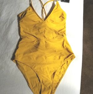 One piece swimsuit, gold.